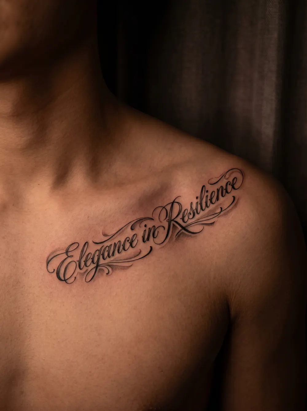 Script lettering across the collarbone